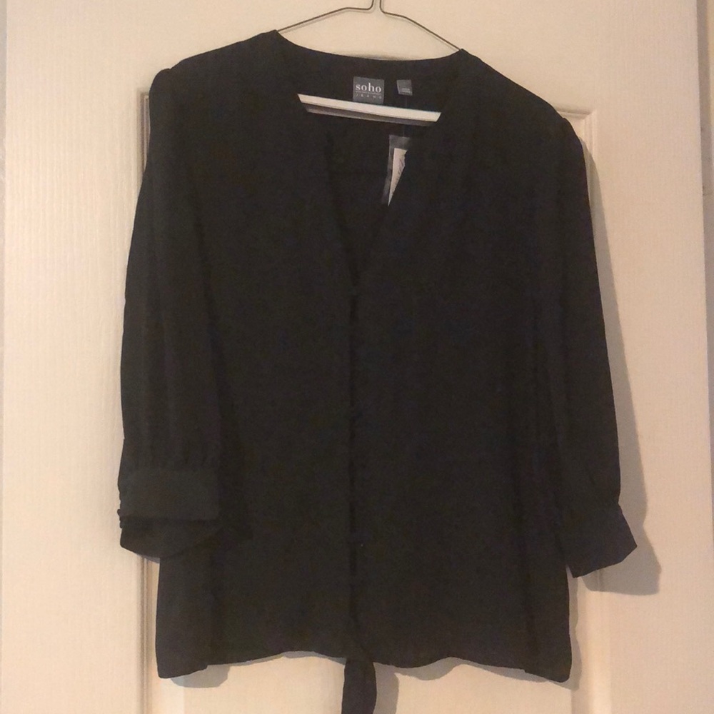 Sheer dressy black blouse with tie at the bottom.